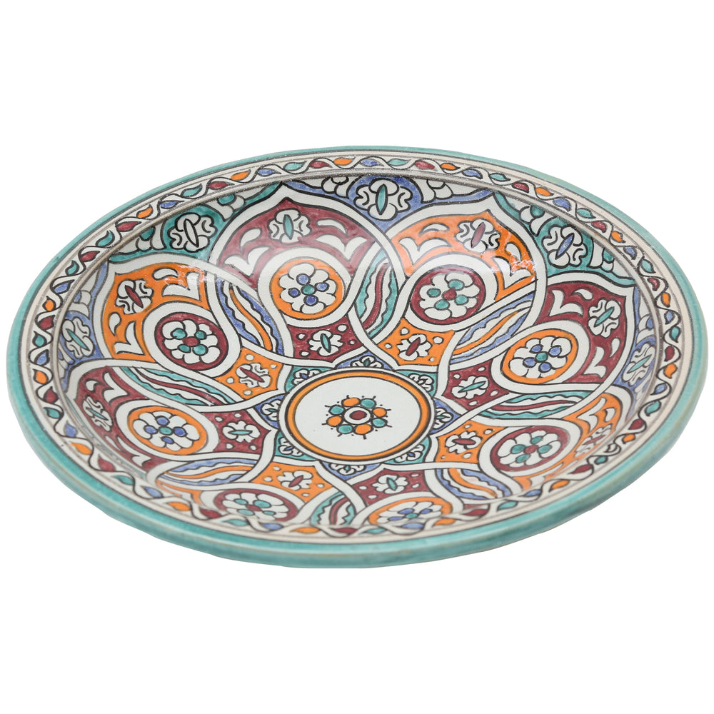 Handbemalte Keramikschale mit verschlungenem Kreisornament in Türkis, Orange und Bordeauxrot