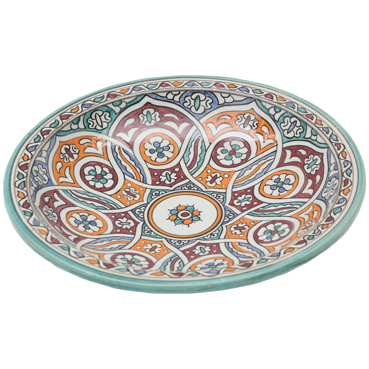 Handbemalte Keramikschale mit verschlungenem Kreisornament in Türkis, Orange und Bordeauxrot